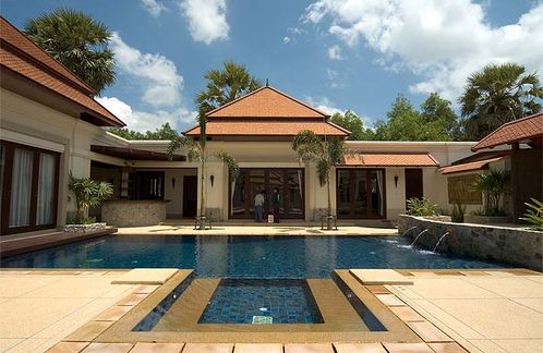 Looking over the swimming pool to the living room