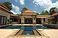 Looking over the swimming pool to the living room