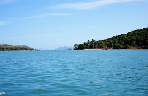 Take a longtail boat to explore Phang Nga Bay