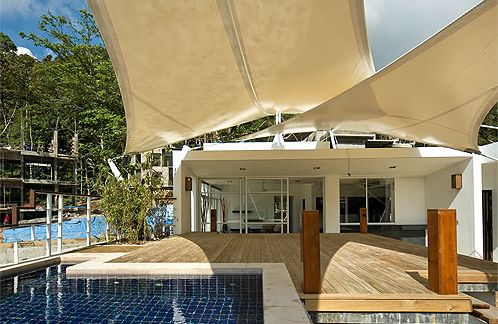 The view of the deck and shade sail looking into the penthouse
