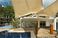 The view of the deck and shade sail looking into the penthouse