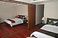 The guest bedrooms, with dividing partition drawn back