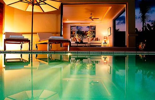 The pool and living room at dusk