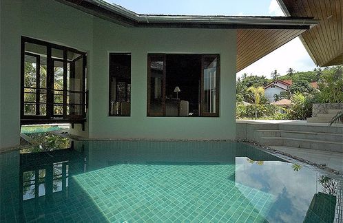 View of living room across the pool