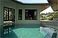 View of living room across the pool