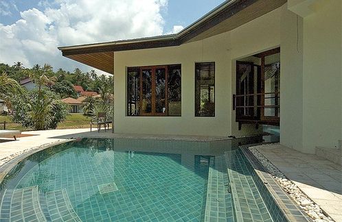 View of living room across the pool