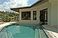 View of living room across the pool